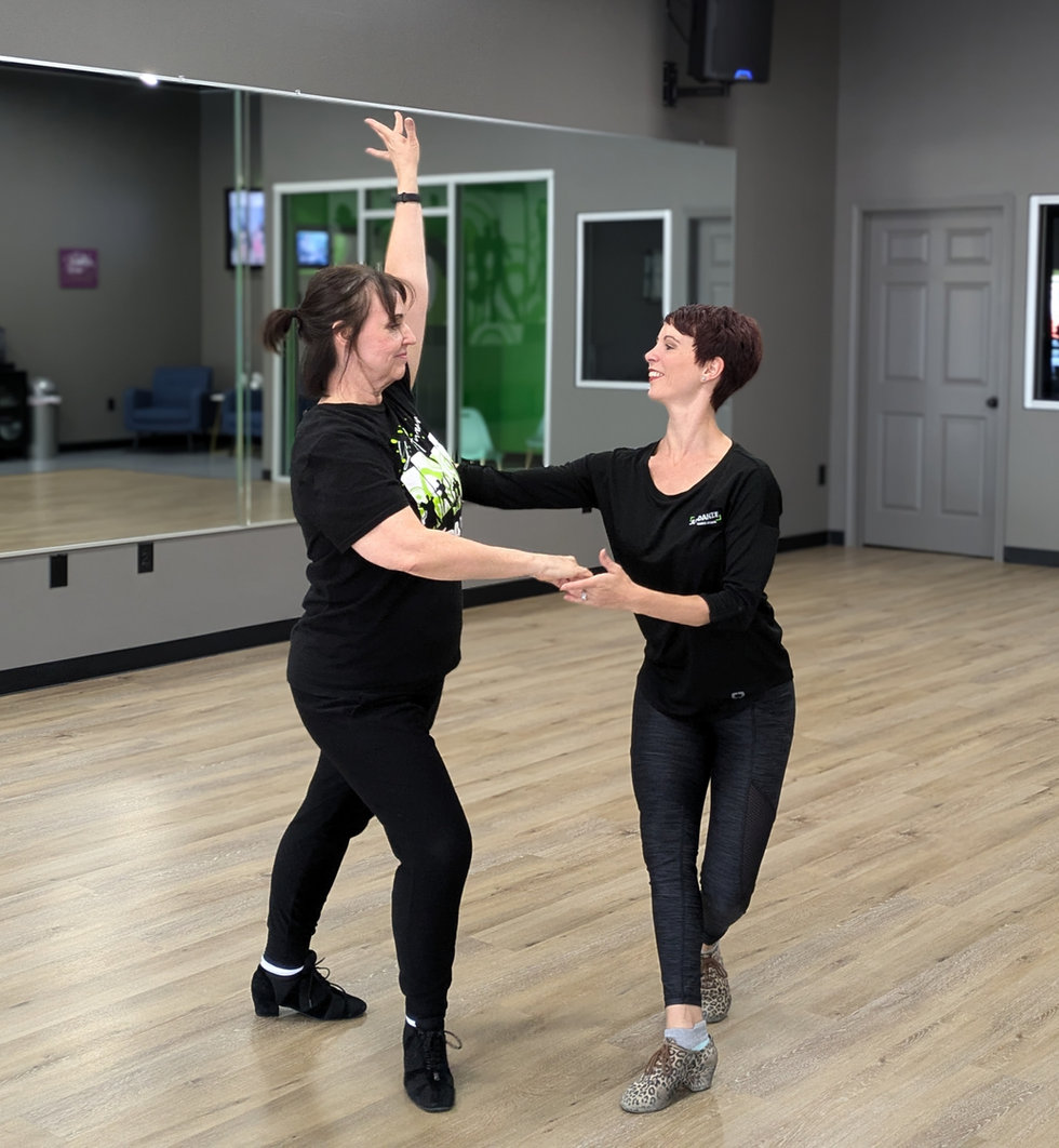 Adult couple ballroom dancing at Just Danze studio in Spring, TX